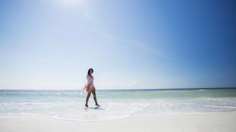 Toes in the surf on a white-sand beach