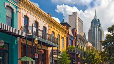 Colorful buildings line historic Dauphin Street in the heart of downtown Mobile, Alabama