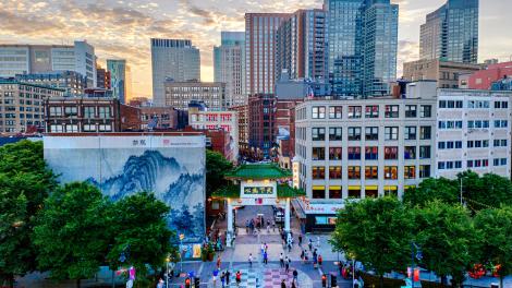 The sun sets over Chinatown Park in Boston, Massachusetts