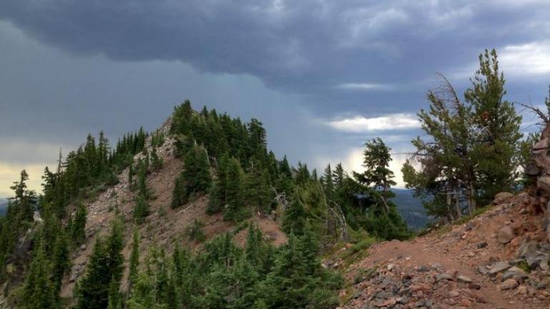 I hustled up the trail, pausing to take photos of the mounting storm because it was so beautiful as it chased me along the ridge.