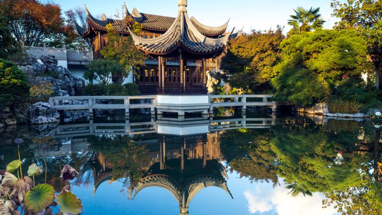 Serene reflections in a pond at the Lan Su Chinese Garden