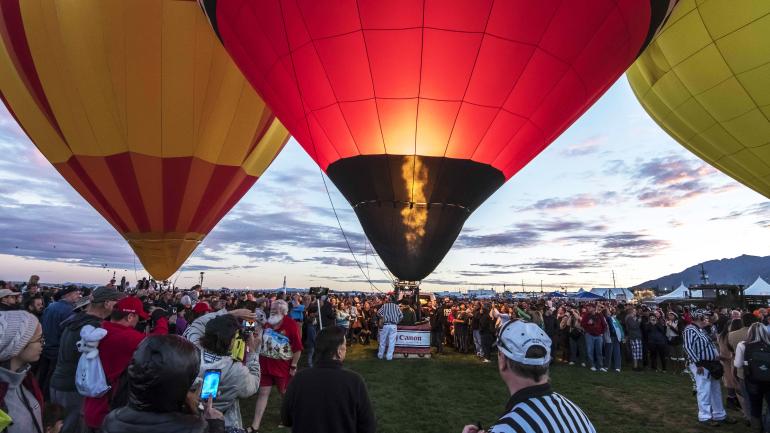 Glow of the balloons as dusk sets in at the festival grounds 