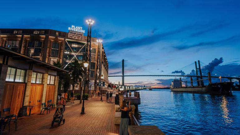 Night falls over the Plant Riverside District, a lively entertainment hub in Savannah