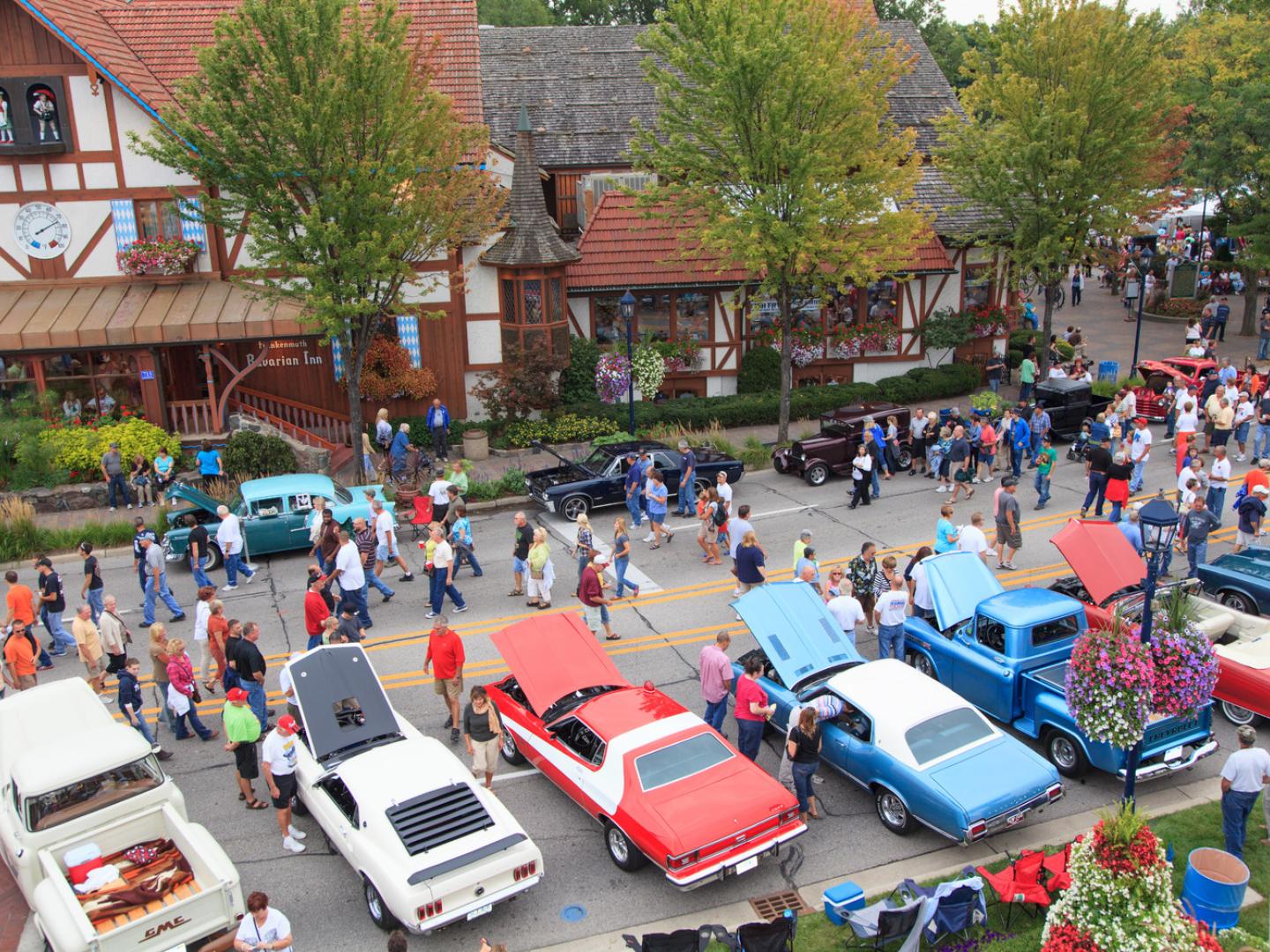 Crowds enjoying classic cars at the Frankenmuth Auto Fest