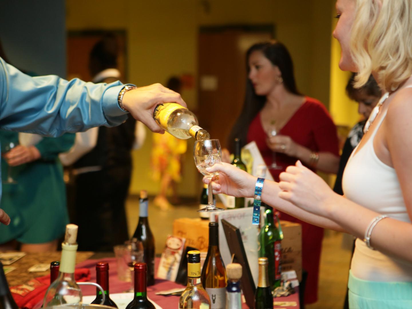 Sampling wine during the SeaGrapes Fine Wine & Food Festival at The Florida Aquarium in Tampa, Florida