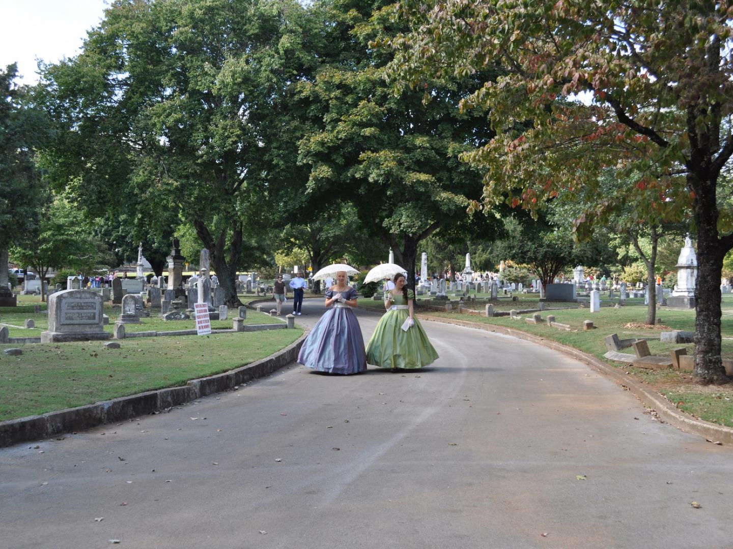 Costumed historic characters at the Maple Hill Cemetery Stroll in Huntsville, Alabama