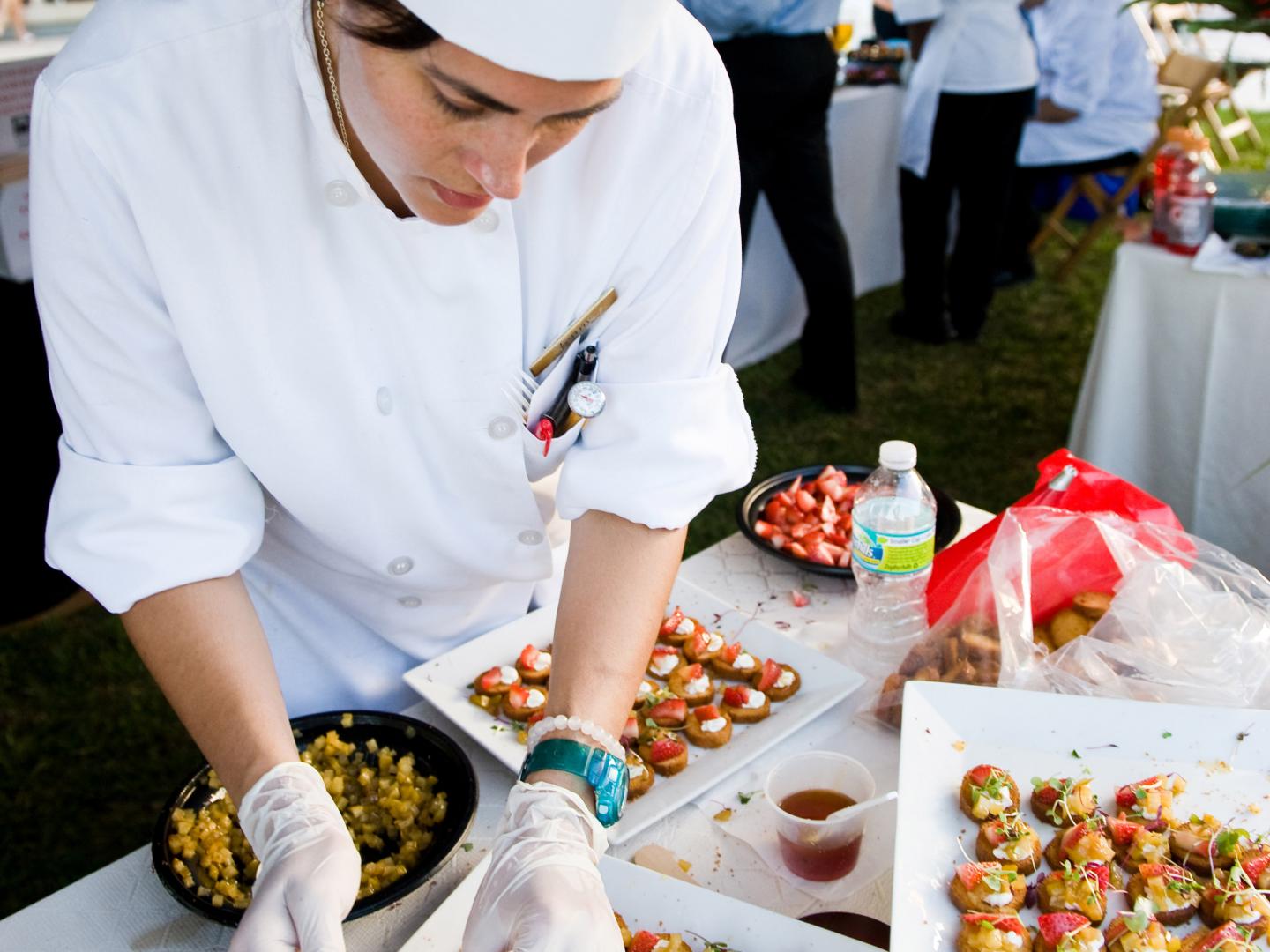 A chef preparing samples at Flavor Palm Beach in Florida