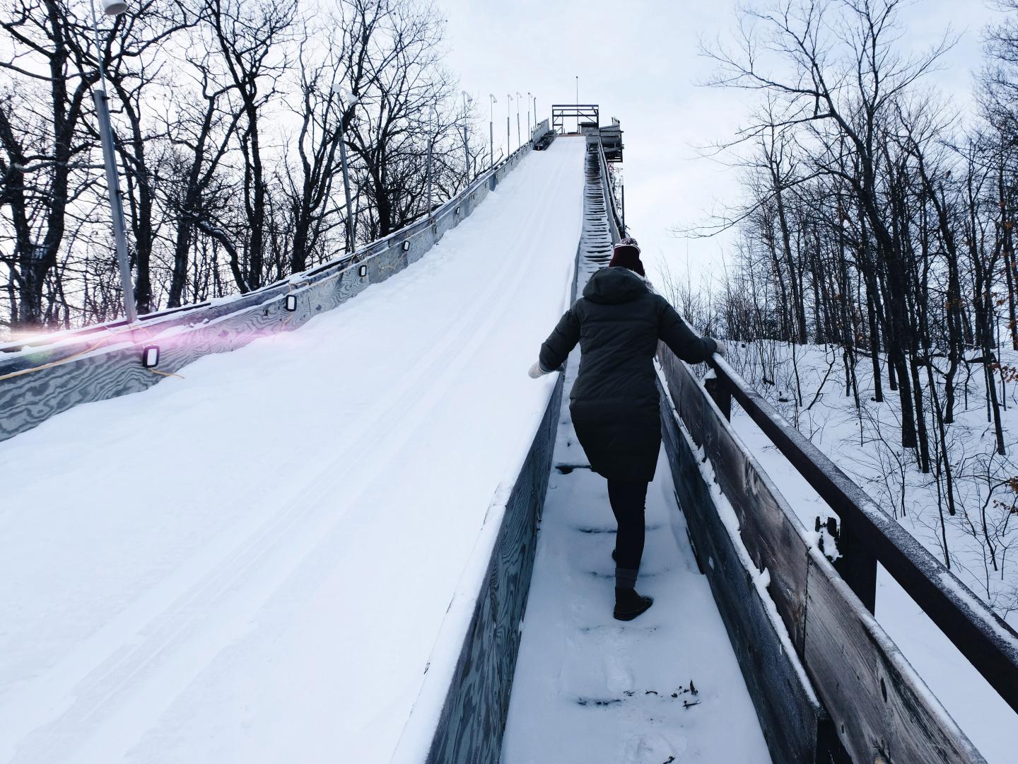 Climbing up the ski jump during the Annual Ishpeming Ski Jumping Tournament in Marquette, Michigan