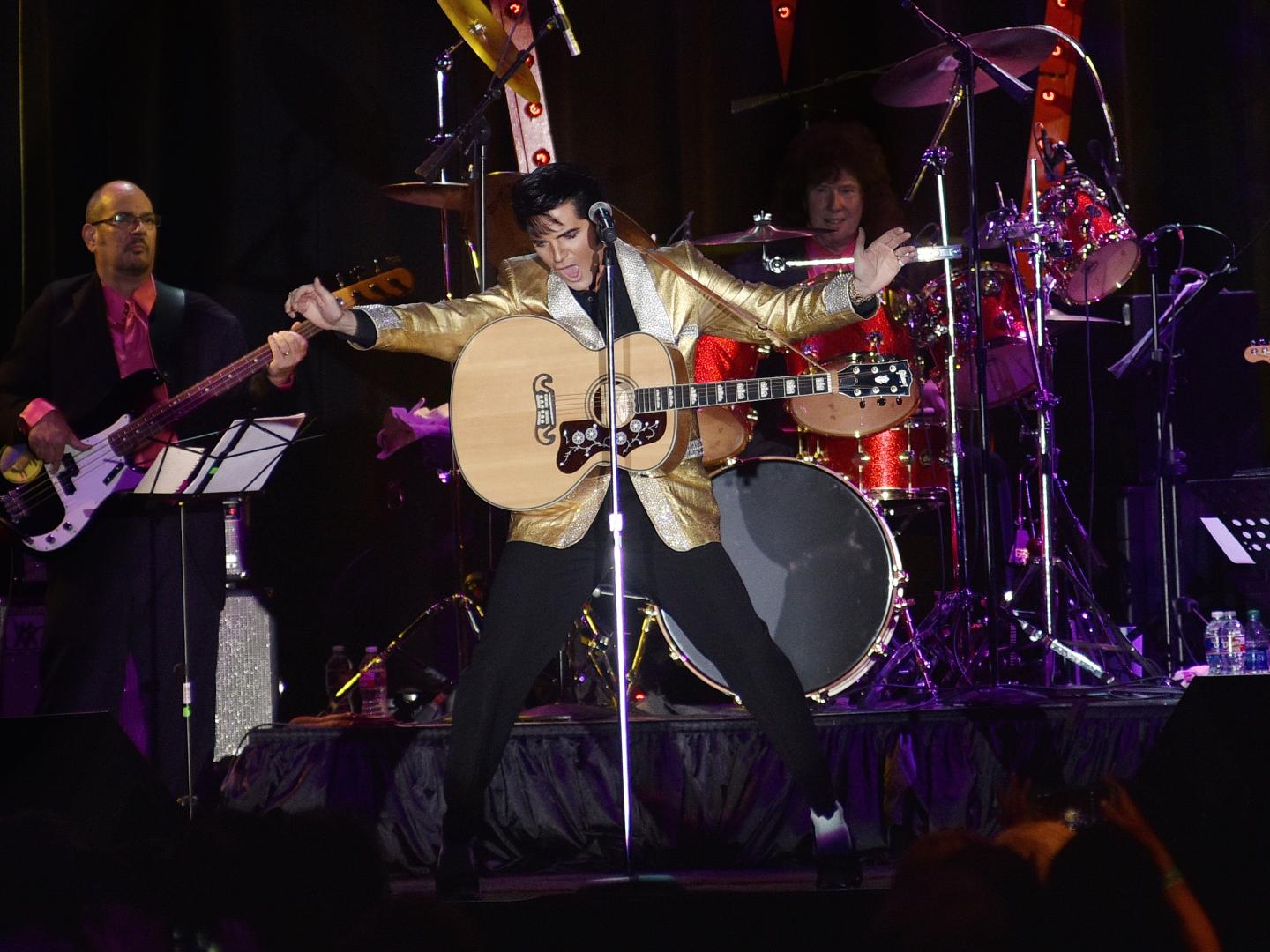 Elvis performer rocking out at a show during Elvis Week in Memphis, Tennessee