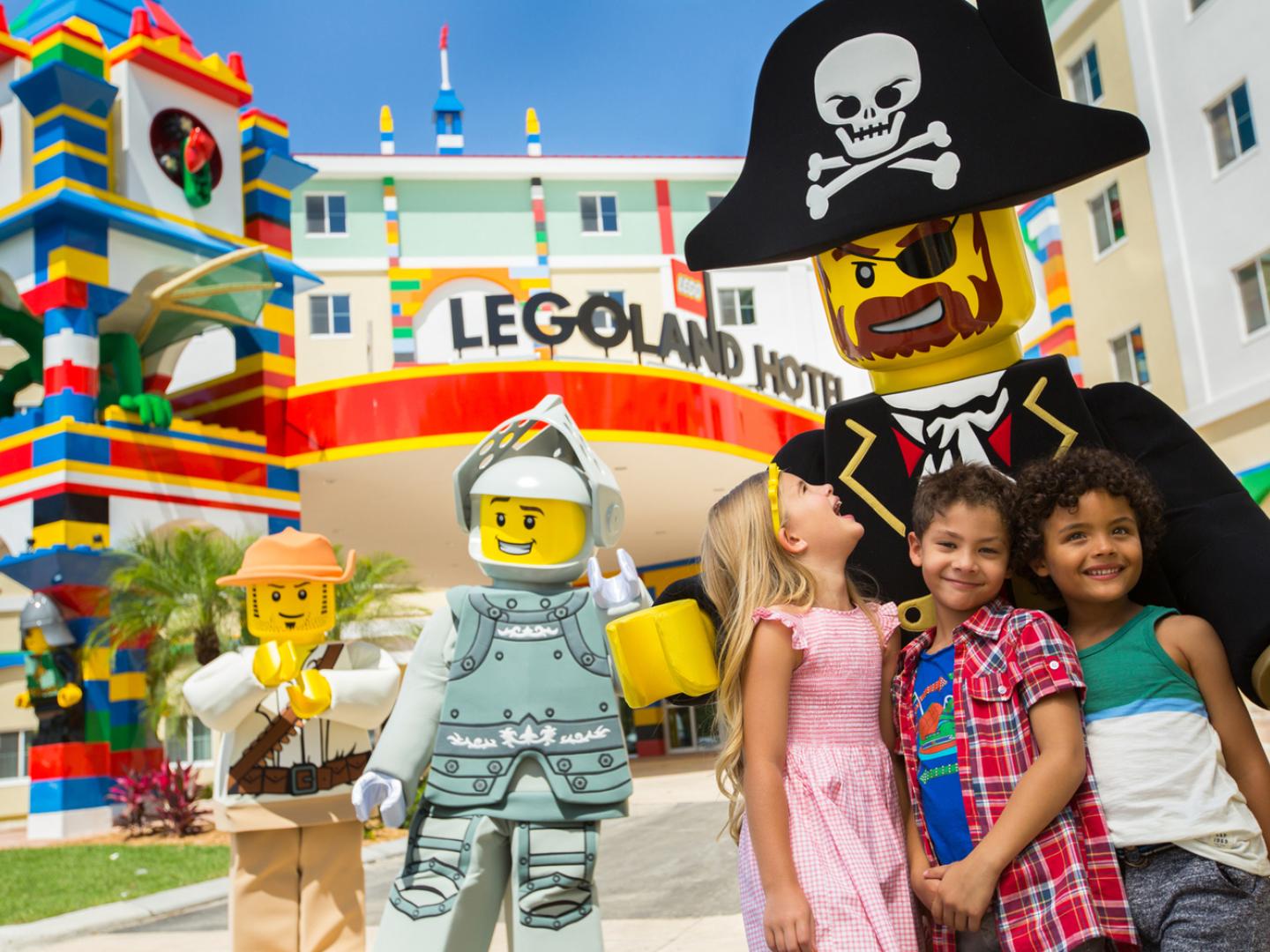 Posing with characters at LEGOLAND Florida Resort in Winter Haven, Florida