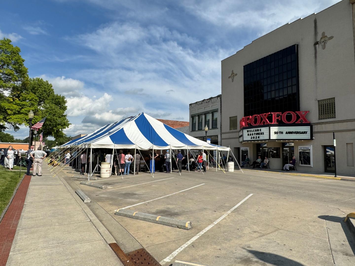 A crowd gathers outside the Fox Theater Event Center in Sedalia, Missouri, during the The Scott Joplin International Ragtime Festival