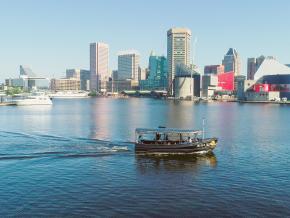 A water taxi cruising around the Inner Harbor in Baltimore, Maryland A water taxi cruising around the Inner Harbor in Baltimore, Maryland