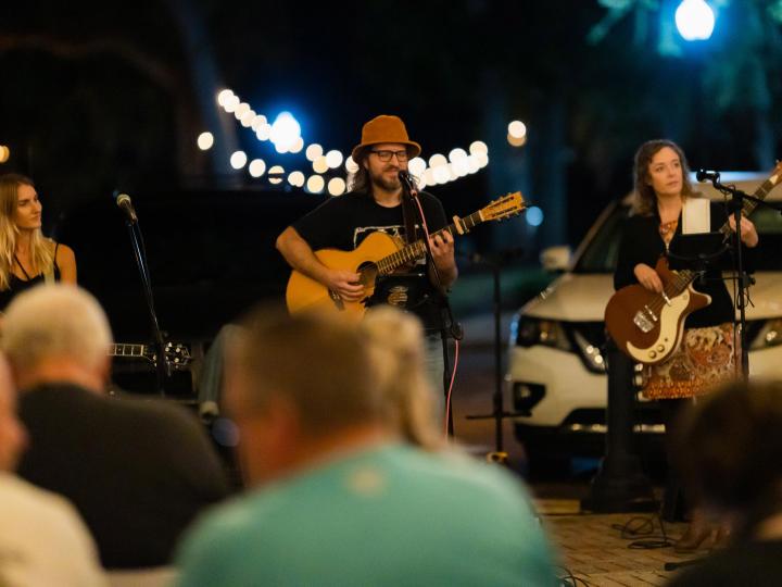 Performers onstage at the Panama City Songwriters Festival in Florida