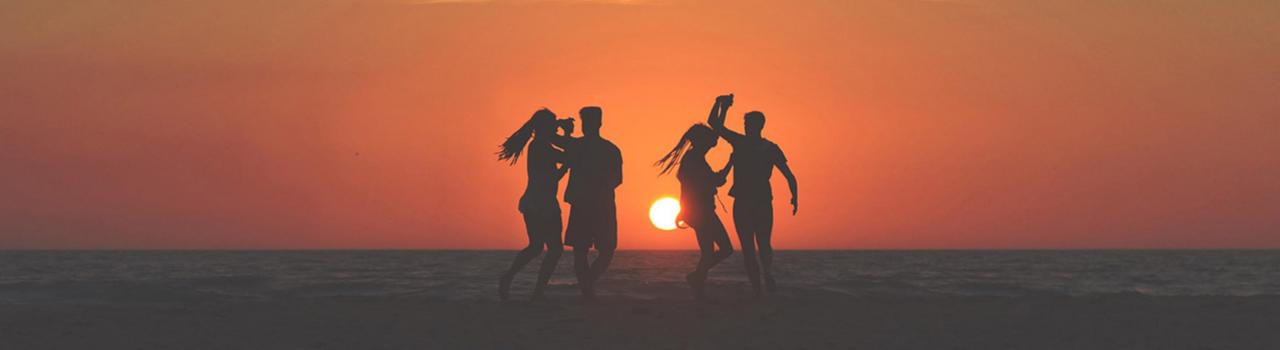 Dancing on the beach at sunset