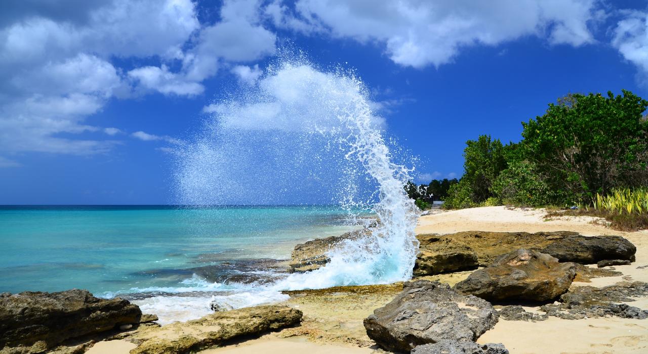 Waves crashing against the shore at Frederiksted Beach