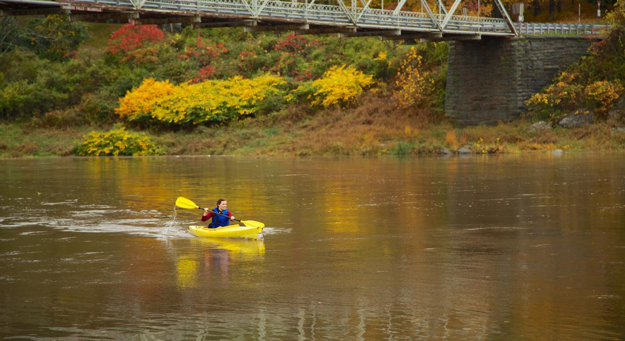 River kayaking in autumn 