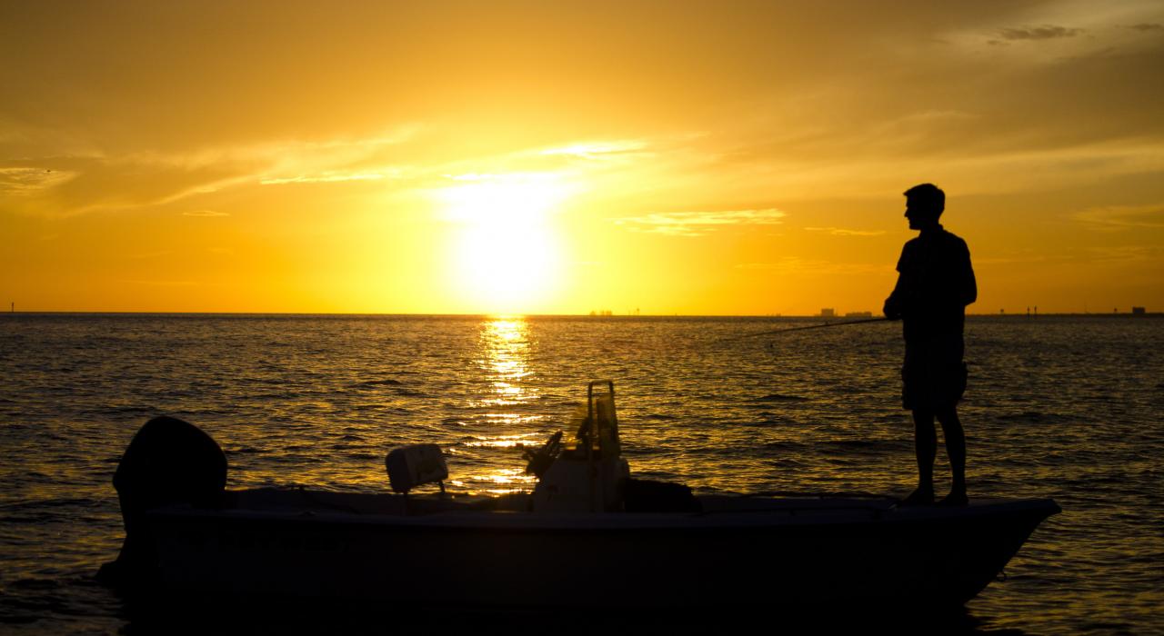 Fishing at sunset in the Gulf of Mexico