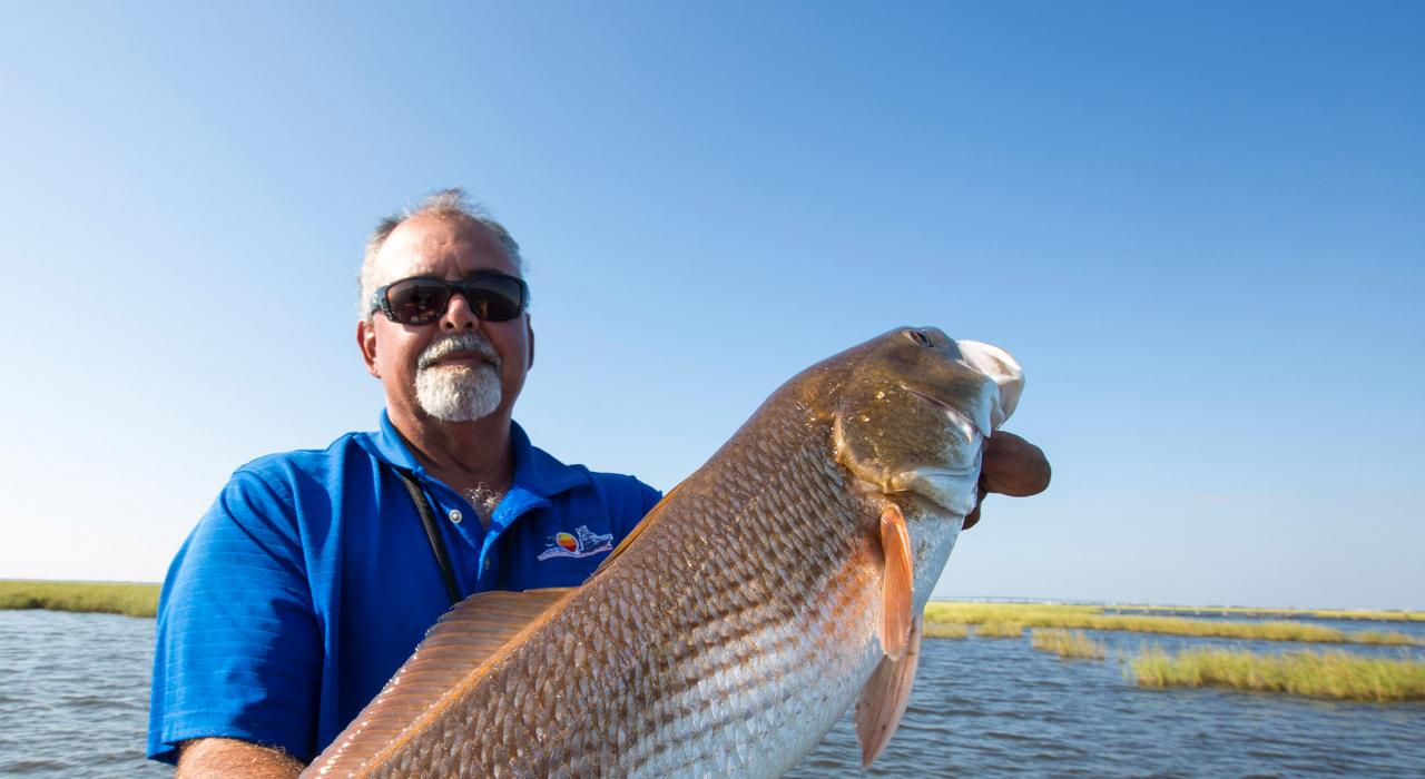 Showing off a big fish caught on a local fishing charter