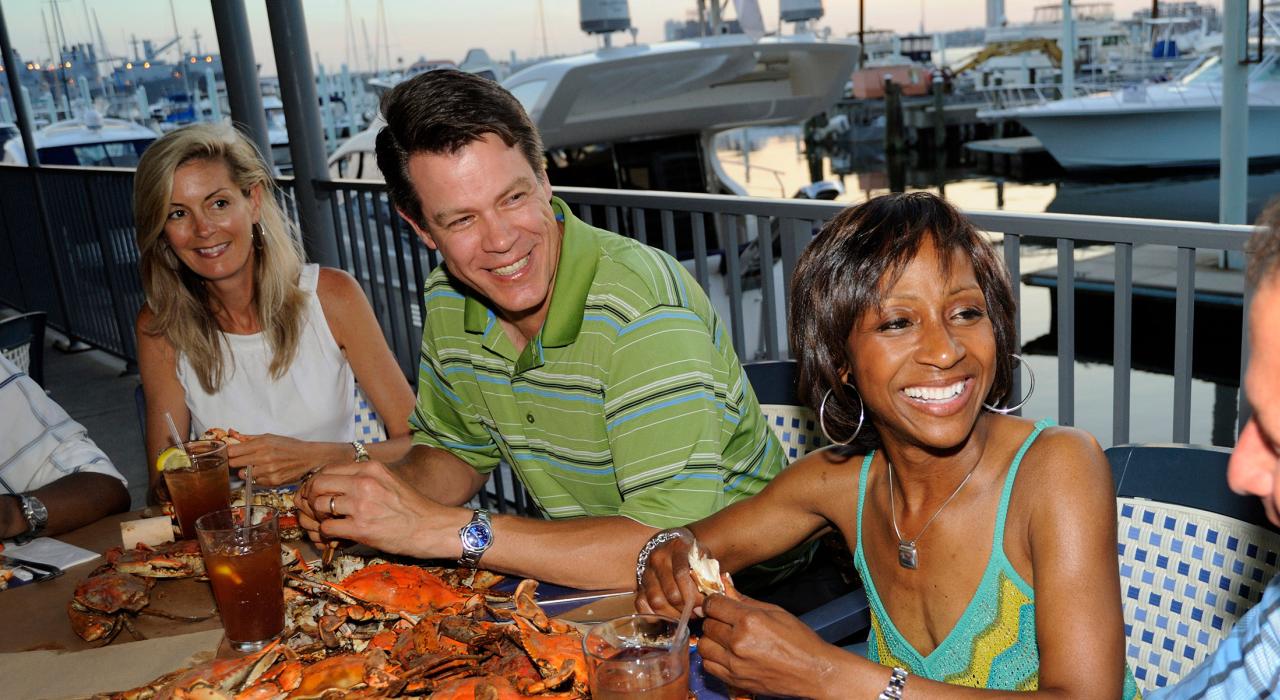 Feasting on steamed crab platters at a waterfront restaurant