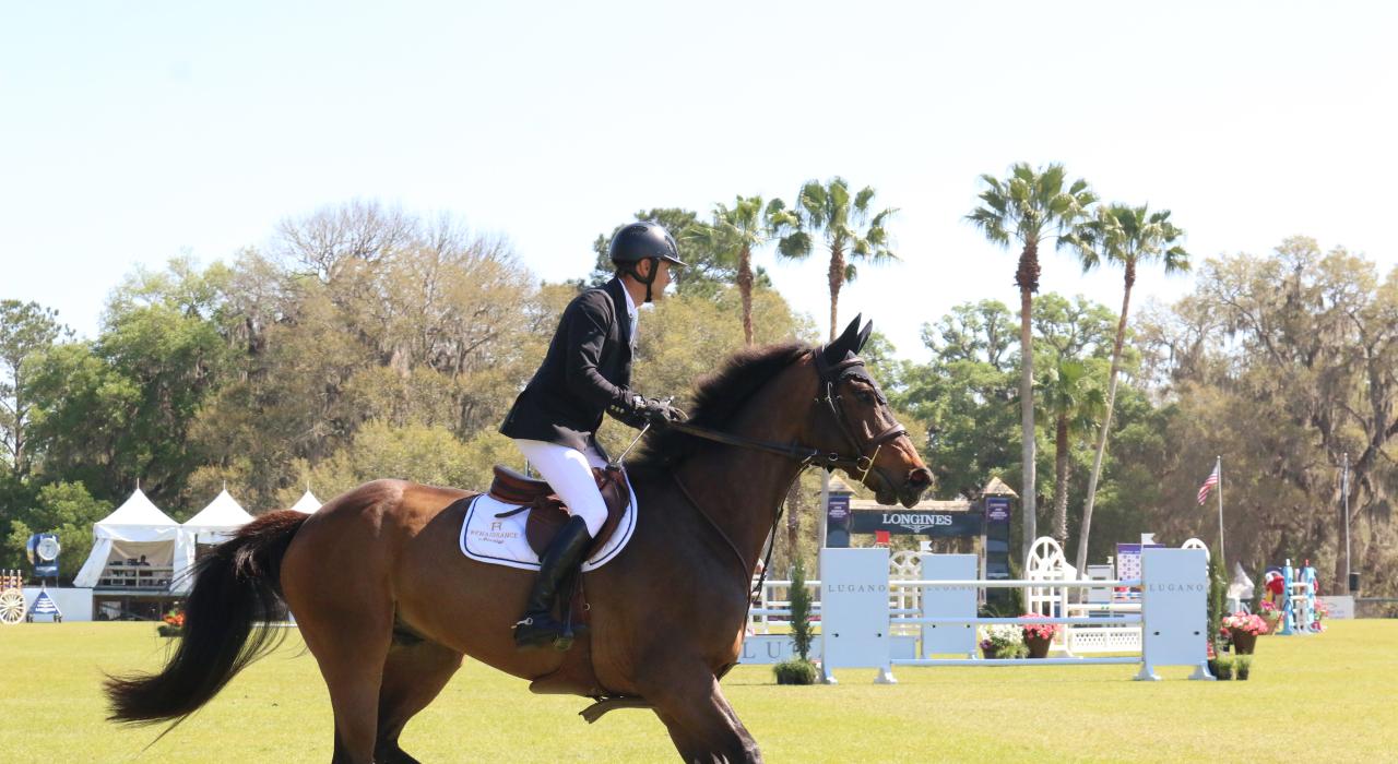 A jockey and horse competing in the annual Live Oak International equestrian competition