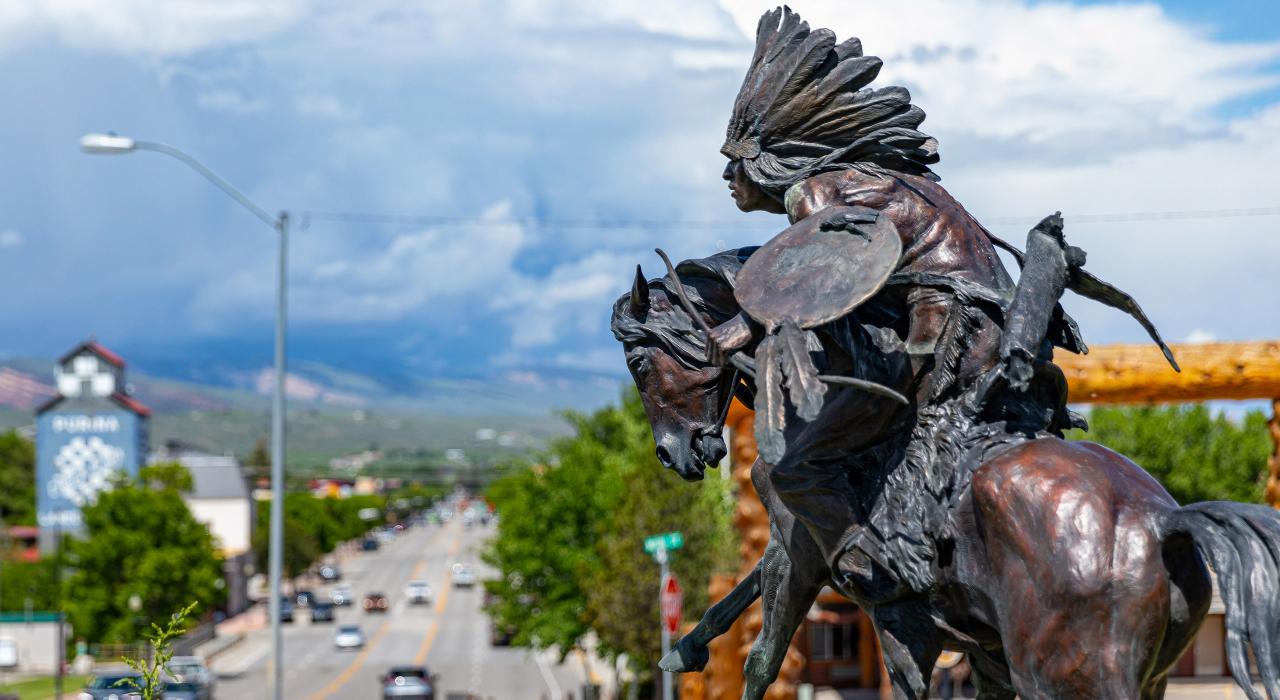 A sculpture by artist Ken Payne entitled Dust of the Fur Trade greets visitors to Lander