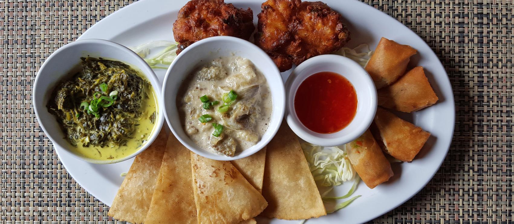 A Chamorro chesa platter, filled with a selection of local delicacies