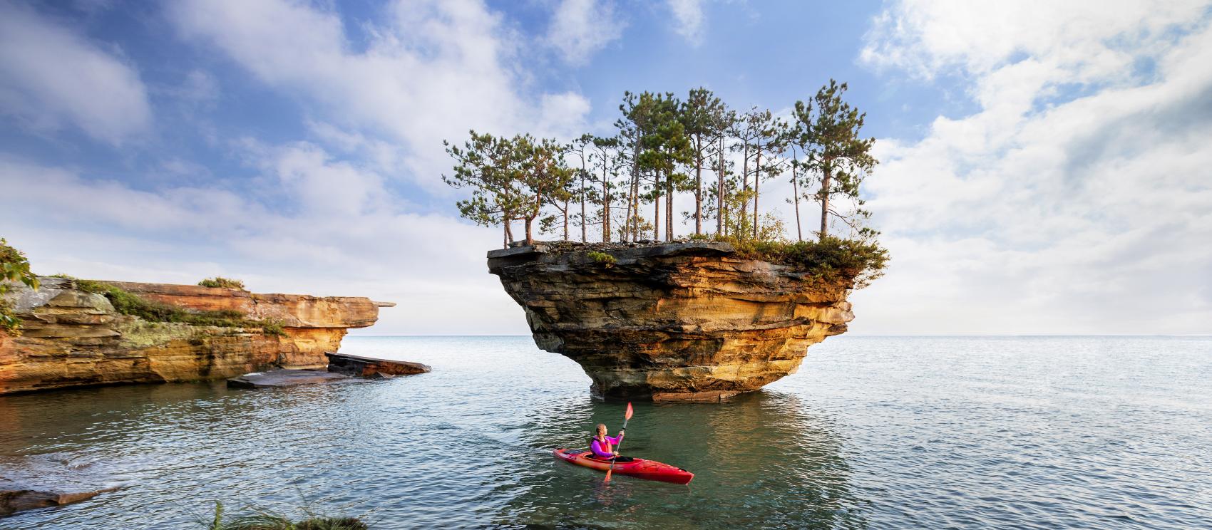 Kayaking past Turnip Rock in Lake Huron off the coast of Point Aux Barques